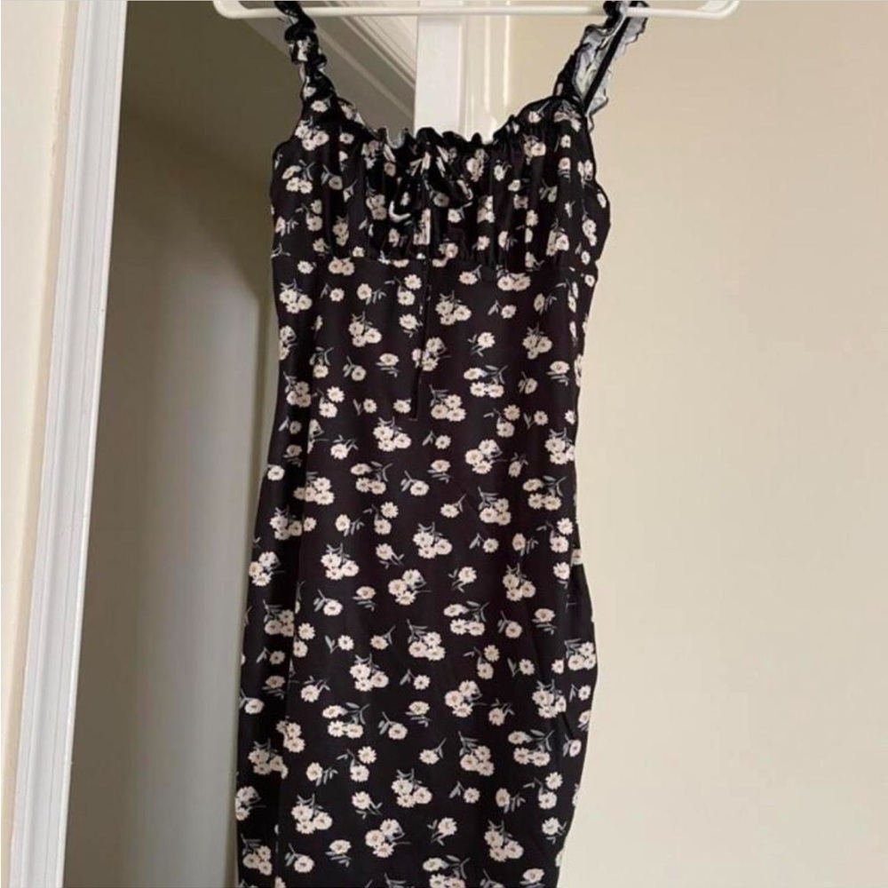 Black and white floral mini dress. No tag but fits like a medium.